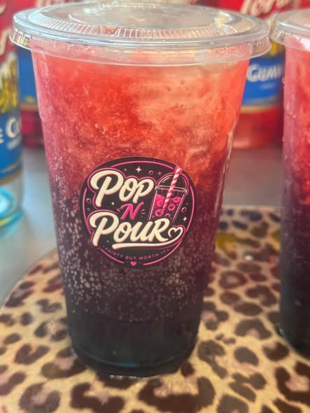 A pink and purple layered Pop N Pour soda