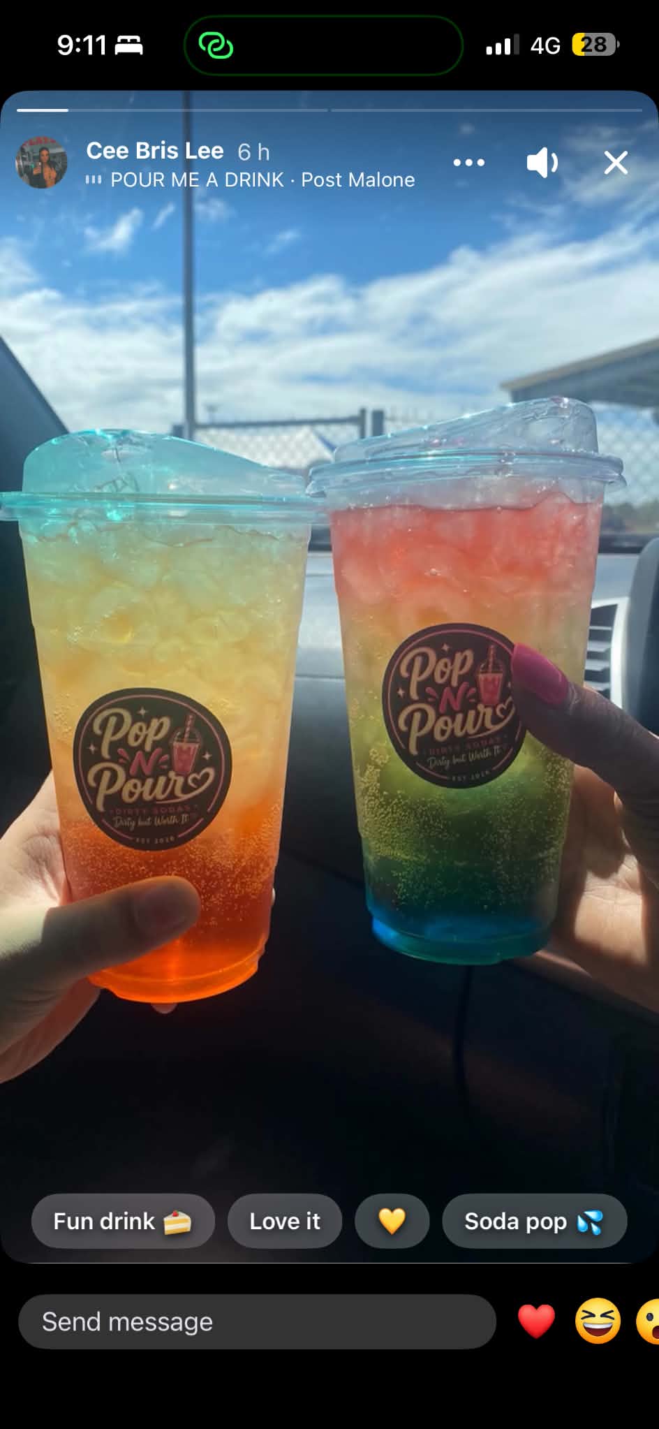 Two colourful Pop N Pour sodas held up in the sunshine